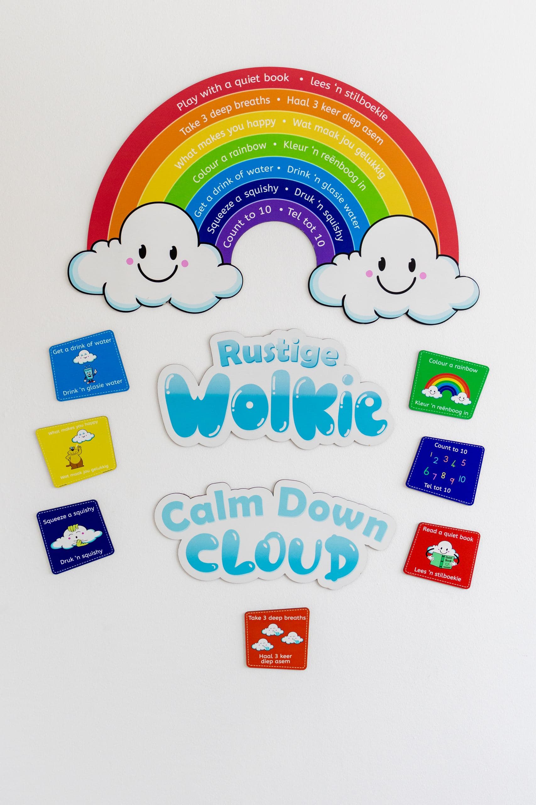 A bilingual ‘Calm Down Cloud’ rainbow wall display in a classroom